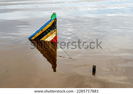 The Sinking Boat in the River
