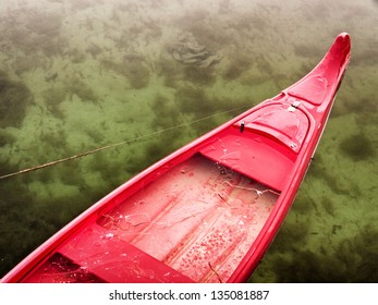 Sinking Canoe At A Lake