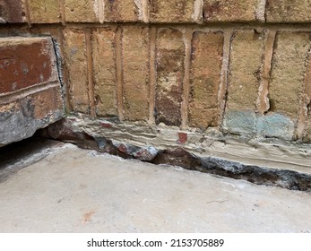 Sinking concrete foundation in need of mudjacking leveling repair. Sunken cement slab porch. - Shutterstock ID 2153705889