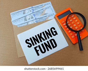 Sinking Fund Concept for Long Term Savings Goals, Financial Planning Strategy with Wooden Blocks, Coins and Paper Note for Future Investment. 
