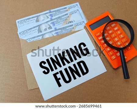 Sinking Fund Concept for Long Term Savings Goals, Financial Planning Strategy with Wooden Blocks, Coins and Paper Note for Future Investment. 