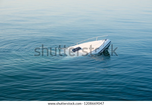 Sinking modern large white boat goes underwater