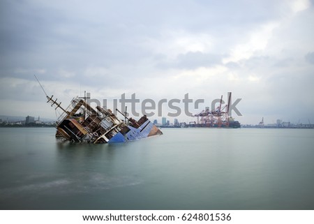 Sinking ship. Industrial sea port of Mersin. Turkey