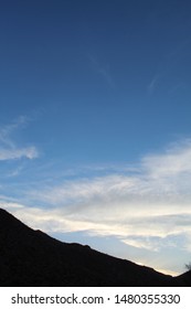 A Sinking Star Over The Cottonwood Mountains In The Colorado Desert Region Of Joshua Tree National Park Imparts A Magical Atmosphere, And Admiration For Native Plants Growing In Their Substrate.