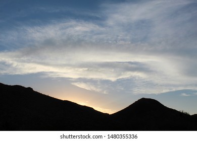 A Sinking Star Over The Cottonwood Mountains In The Colorado Desert Region Of Joshua Tree National Park Imparts A Magical Atmosphere, And Admiration For Native Plants Growing In Their Substrate.