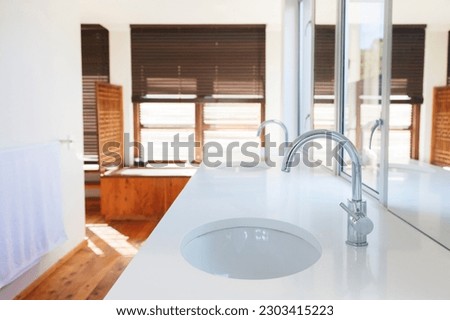 Sinks, counter, and mirrors in modern bathroom
