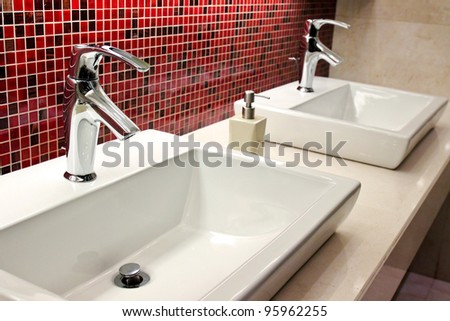 sinks and taps in a public toilet