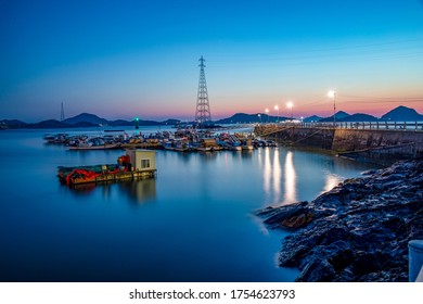 Sinsido Island, Gunsan-si, Jeollabuk-do, South Korea - April 27, 2020: Night view of a small port with fishing boats after sunset
