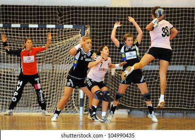 SIOFOK, HUNGARY - AUGUST 24: Unidentified players in action at a Siofok Cup handball game Siofok KC pink (HUN) vs. HYPO NO blue (AUT) August 24, 2008 in Siofok, Hungary.