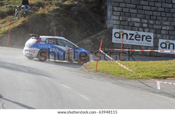 SION, SWITZERLAND -\
OCTOBER 28: the leader on Day 1, Stage 1 of the International Rally\
of the Valais Rossetti luca in a grande punto: October 28, 2010 in\
Sion Switzerland