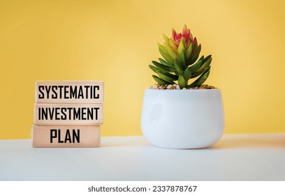 SIP system investment plan shown on wooden blocks