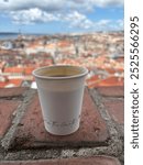 Sipping a cappuccino while enjoying the lookout from the St George Castle out over Lisbon city in the morning. Castelo De Sao Jorge