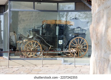 Sir Moses Montefiore's travelling carriage at Yemin Moshe a historic neighborhood in Jerusalem, Israel overlooking the Old City. - Shutterstock ID 2237242355