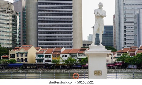  Sir Thomas Stamford Bingley Raffles Statue With Buildings And River Background.