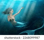 Siren of the sea. Shot of a mermaid swimming in solitude in the deep blue sea - ALL design on this image is created from scratch by Yuri Arcurs team of professionals for this particular photo shoot.
