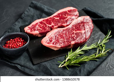 Sirloin A Raw Beef Steak. Black Background, Top View