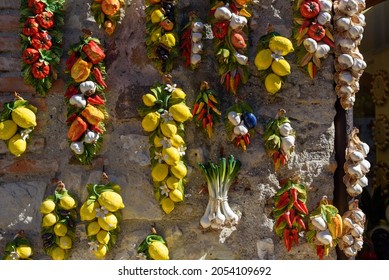 Sirmione, Italy - September 28, 2021: Ceramic Souvenirs Shaped Like Lemons And Garlic.