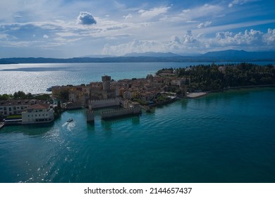 Sirmione, Lake Garda, Italy. Scaligero Castle is a fortress in the historical center of Sirmione town at the Garda Lake in Italy. Scaligero Castle aerial panoramic view.
