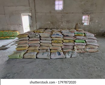 Sirohi Road, India - July 21 2020: Mineral Powder Stored In Misprint Cement Bags At Factory Warehouse