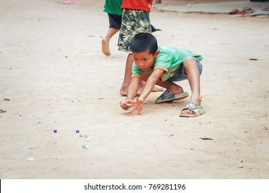 Sisaket,Thailand - October 14,2012 : Children In Local Thai People Enjoy Playing The Glass Balls. 