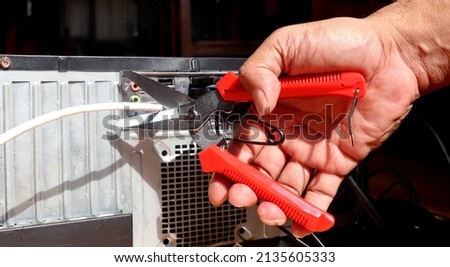 
Sissors cutting a network cable. Wireless concept. 	