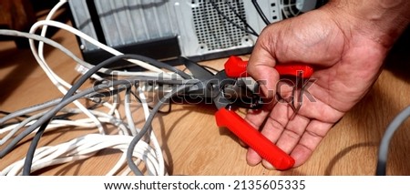 
Sissors cutting a network cable. Wireless concept. 	