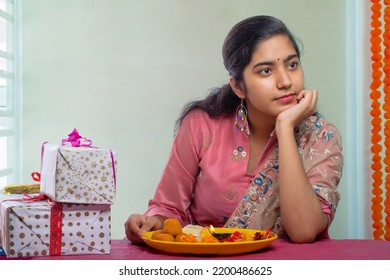 Sister With Pooja Plate And Rakhi Waiting Alone For Her Brother On The Occasion Of Raksha Bandhan