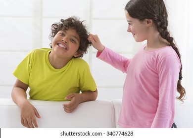 Sister Pulling Brothers Hair