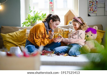 Similar – Image, Stock Photo Little girl painting a picture at home