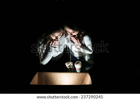 Similar – Boy with sister lighting up with flashlight