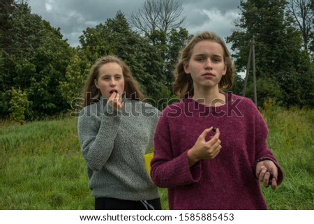 Similar – Image, Stock Photo happy twin sisters stand on a bridge and look up