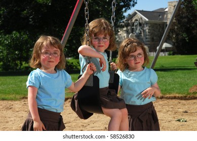 Sisters Swinging On The Swingset