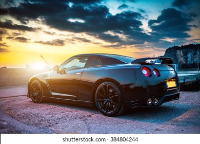 SISTIANA, ITALY JUNE 12, 2013: Photo of a Nissan GT-R Black Edition. The Nissan GT-R is a 2-door 2+2 sports car produced by Nissan and unveiled in 2007.