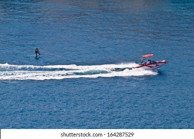 Sit down hydrofoil ski sport, speedboat on blue sea