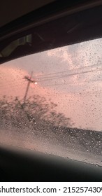 Sit And Watch The Evening Rain Through The Car Window.