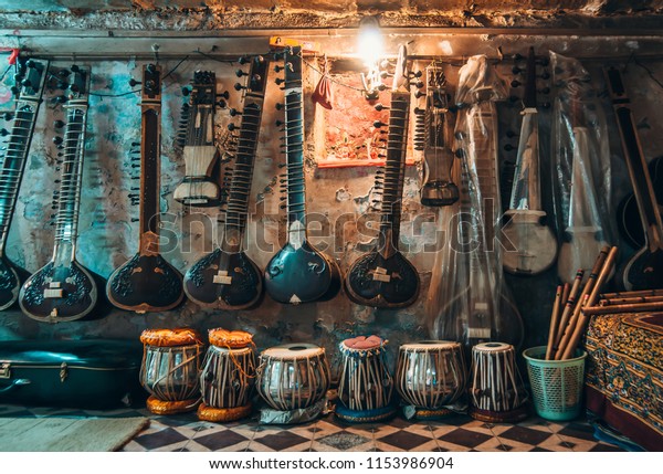 The sitar shop at\
Varanasi street. Traditional indian music. Indian music salon.\
Varanasi backstreet.