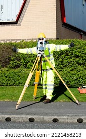 Site Engineer Giving An Ok Sign To Another Engineer During Road Survey