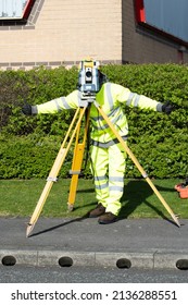 Site Engineer Using Electronic Total Station To Survey Road