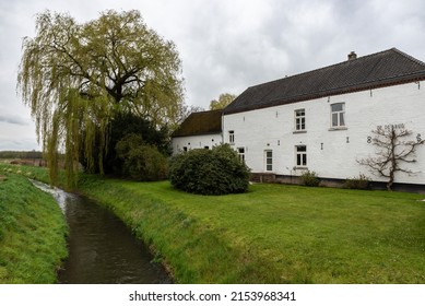 Sittard,  Limburg, The Netherlands - 04 08 2022 - White Country House And The Geleenbeek Creek