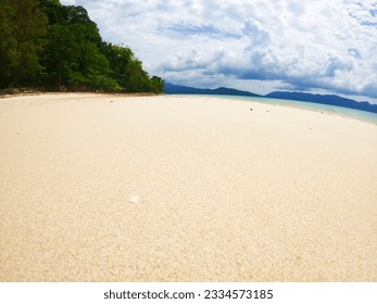 Sitting corner at the sandy beach overlooking the mountains