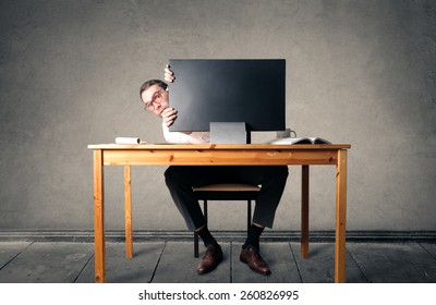 Sitting At His Desk 