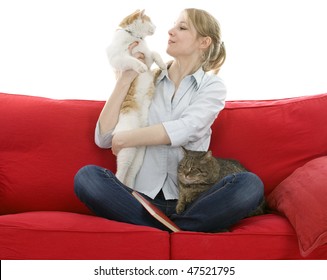 sitting on red sofa young woman with two cats