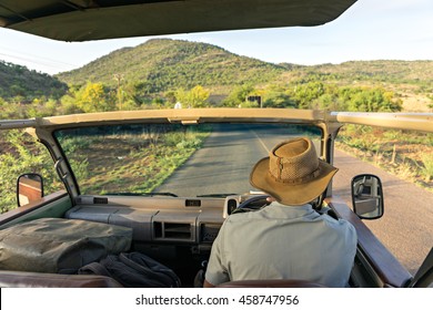 Sitting On The Safari Jeep To Explore The Savannah In Africa 