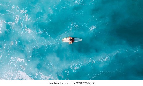 Sitting Surfer Bali Indonesia Drone - Powered by Shutterstock