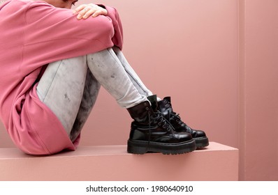 Sitting Woman Wearing Combat Boots