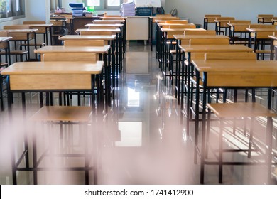 Situation Of Covid-19 Disease Outbreak Resulted In Inability Organize Teaching Learning In College. Lecture School Empty Classroom With Desks Chair Iron Wood When Student Close Stay Home In Highschool