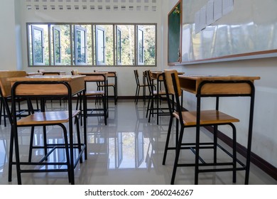 Situation Of Covid-19 Disease Outbreak Resulted In Inability Organize Teaching Learning In College. Lecture School Empty Classroom With Desks Chair Iron Wood When Student Close Stay Home In Highschool