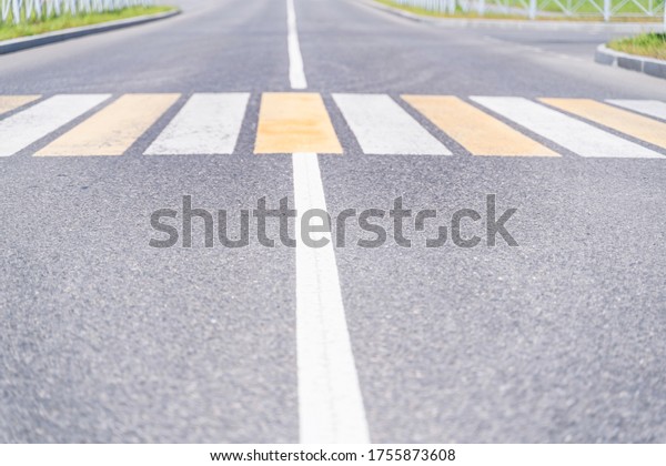 Sity  road  and road markings, focus to the\
foreground, blurred\
background