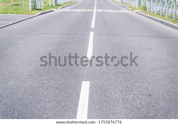 Sity  road  and road markings, focus to the
foreground, blurred
background