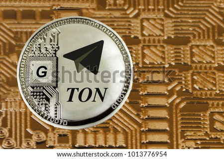 Siver coin TON oon the gold circuit background. Cryptocurrency TON from telegram.